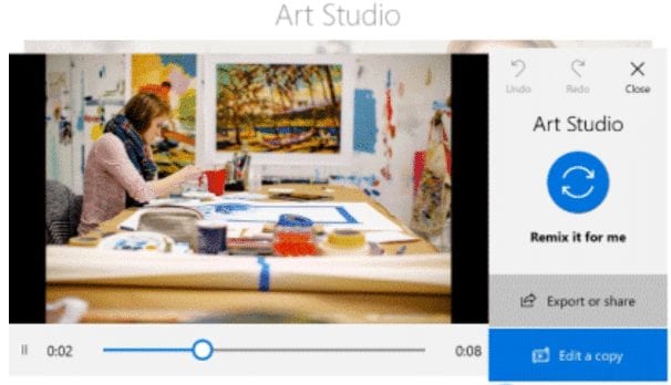 Designer creating a video from still photos using Microsoft Windows video remix feature