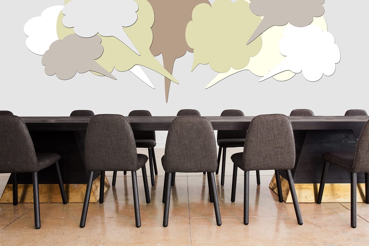 Presentation room with speech bubbles. When someone mentions you in a Microsoft Office 365 comment, you'll receive an email notification. The email includes a link that takes you to the comment in the document or presentation.